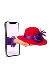 A red hat with purple feathers reaching out of a phone screen